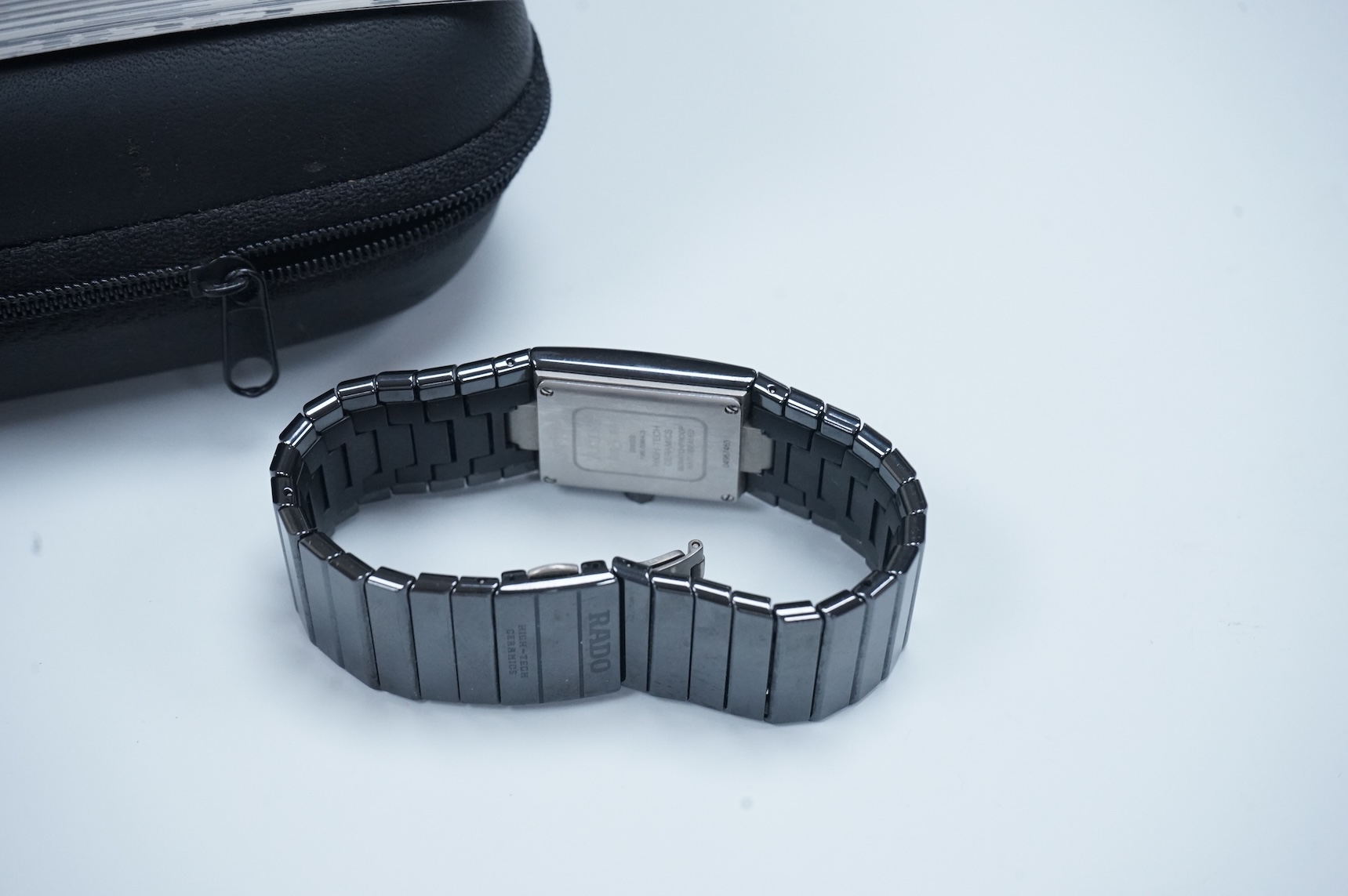 A modern Swiss titanium and ceramic Rado Diastar quartz wrist watch, with rectangular dial and dot markers, case diameter 25mm, with Rado box and booklet.